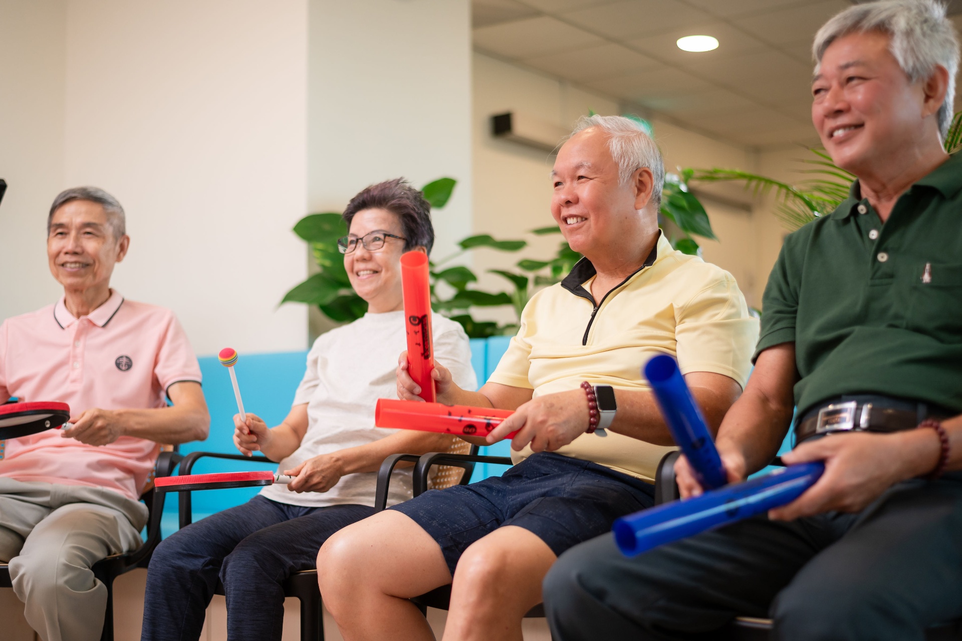 Seniors taking part in a group music activity