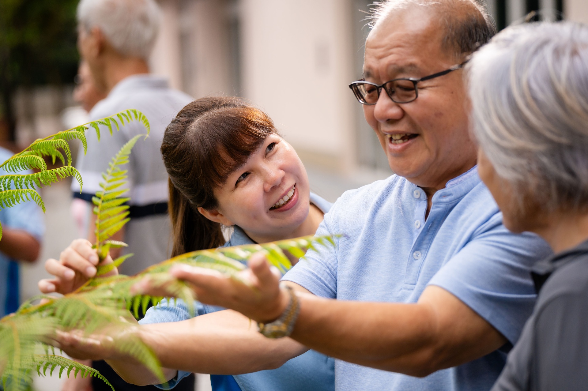 Hovi Care staff interacting with seniors outdoors