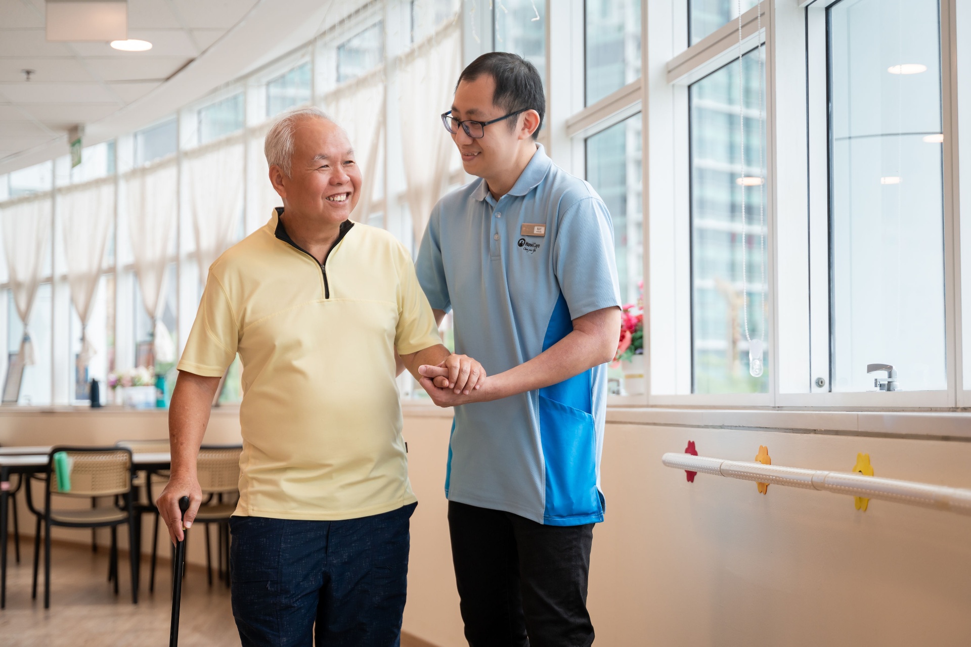 Caregiver assisting a senior while walking